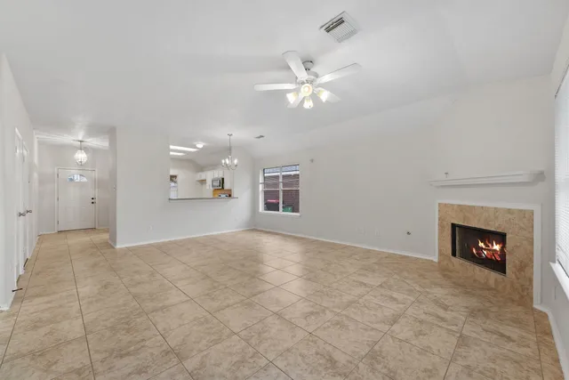 a view of an empty room and fire place
