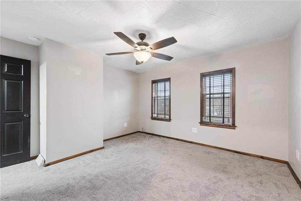 330 Braeburn Road Lower Burrell, PA 15068 - Photo 17 of 31 an empty room with windows and fan