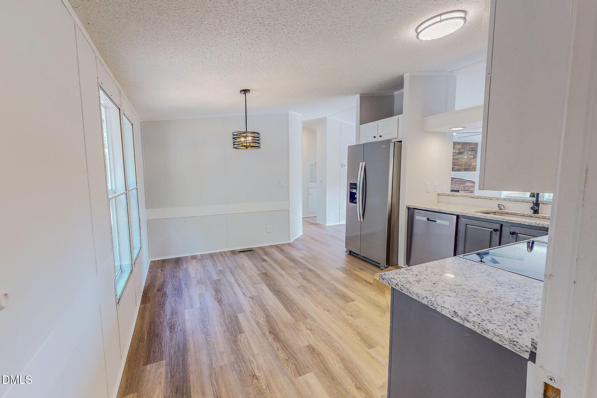 1469 Mollie Mooney Road Roxboro, NC 27574 - Photo 17 of 52 a kitchen with stainless steel appliances granite countertop a refrigerator and a sink