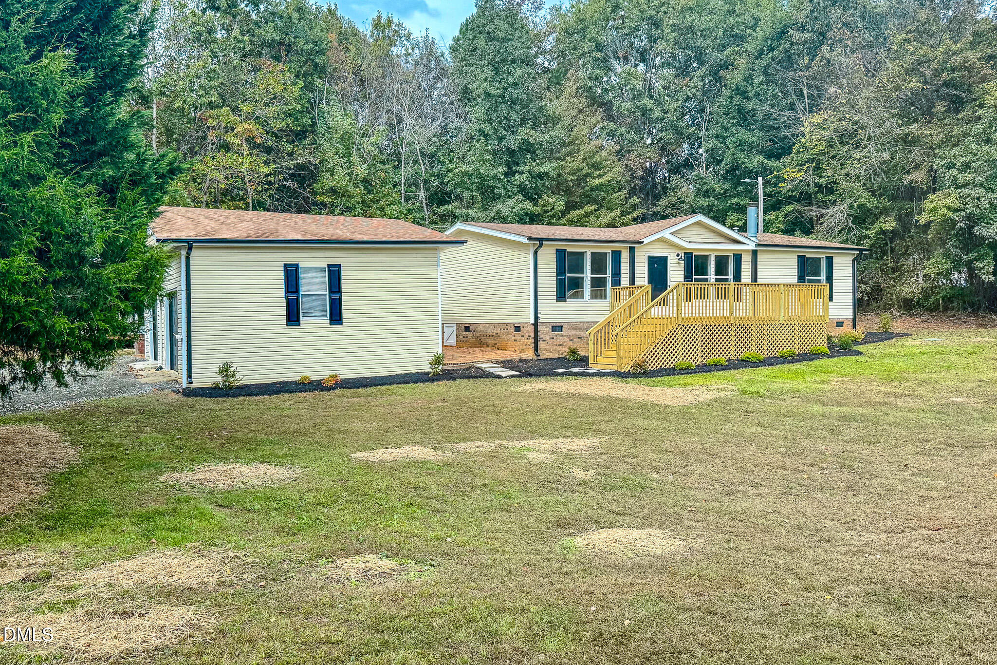 1469 Mollie Mooney Road Roxboro, NC 27574 - Photo 18 of 52 a front view of a house with yard and green space