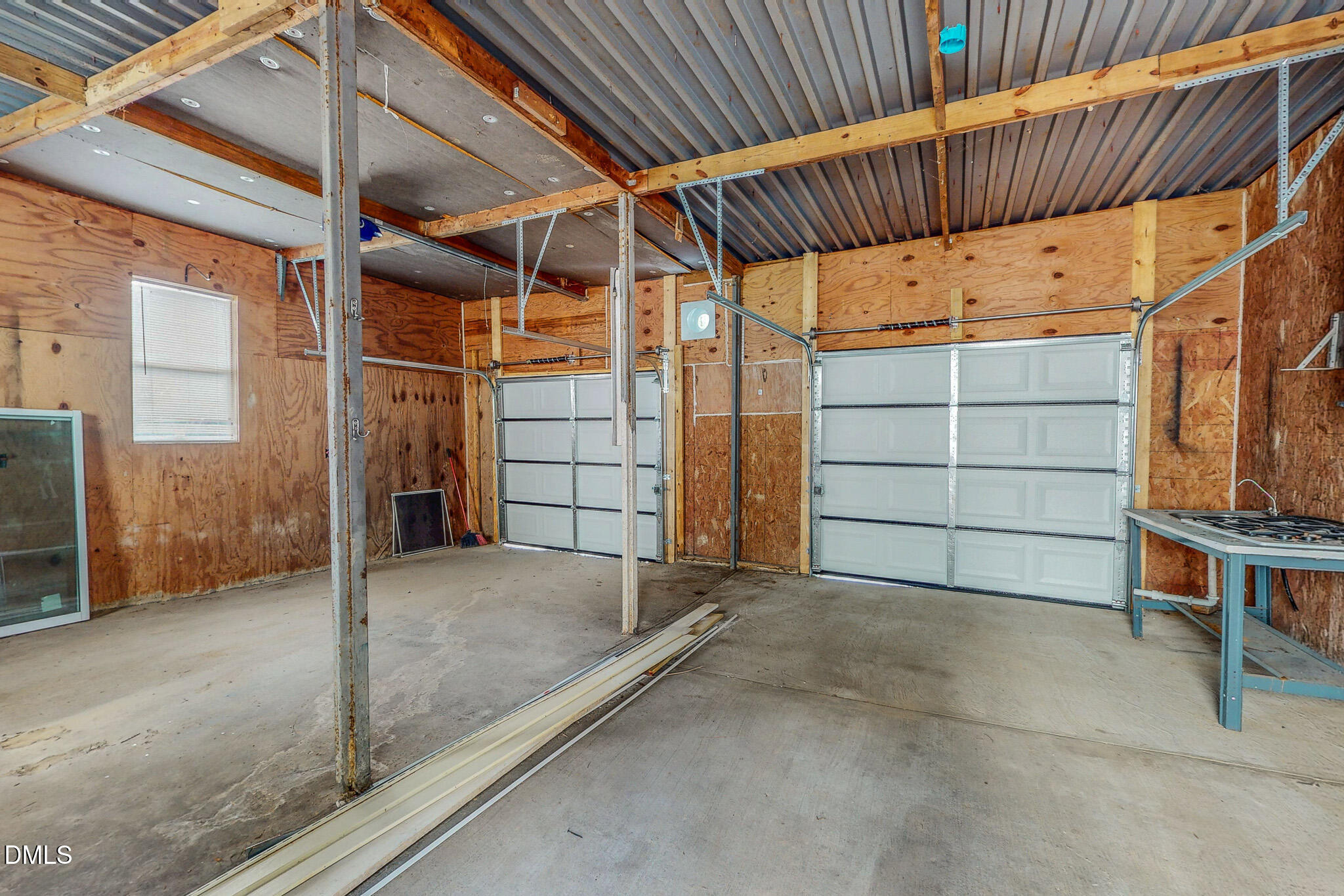 1469 Mollie Mooney Road Roxboro, NC 27574 - Photo 19 of 52 a view of a room with wooden walls