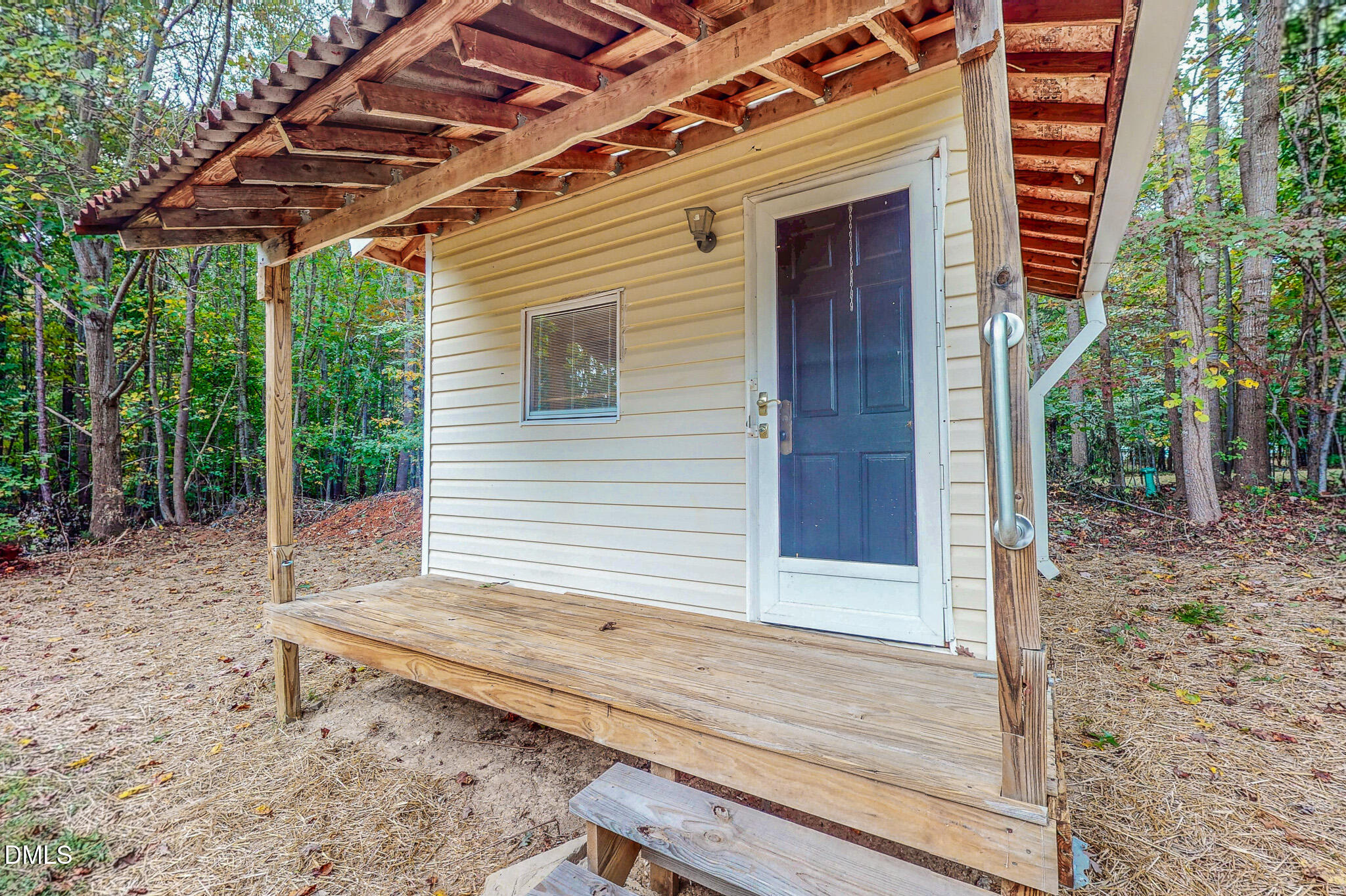 1469 Mollie Mooney Road Roxboro, NC 27574 - Photo 22 of 52 a view of house with backyard and seating area