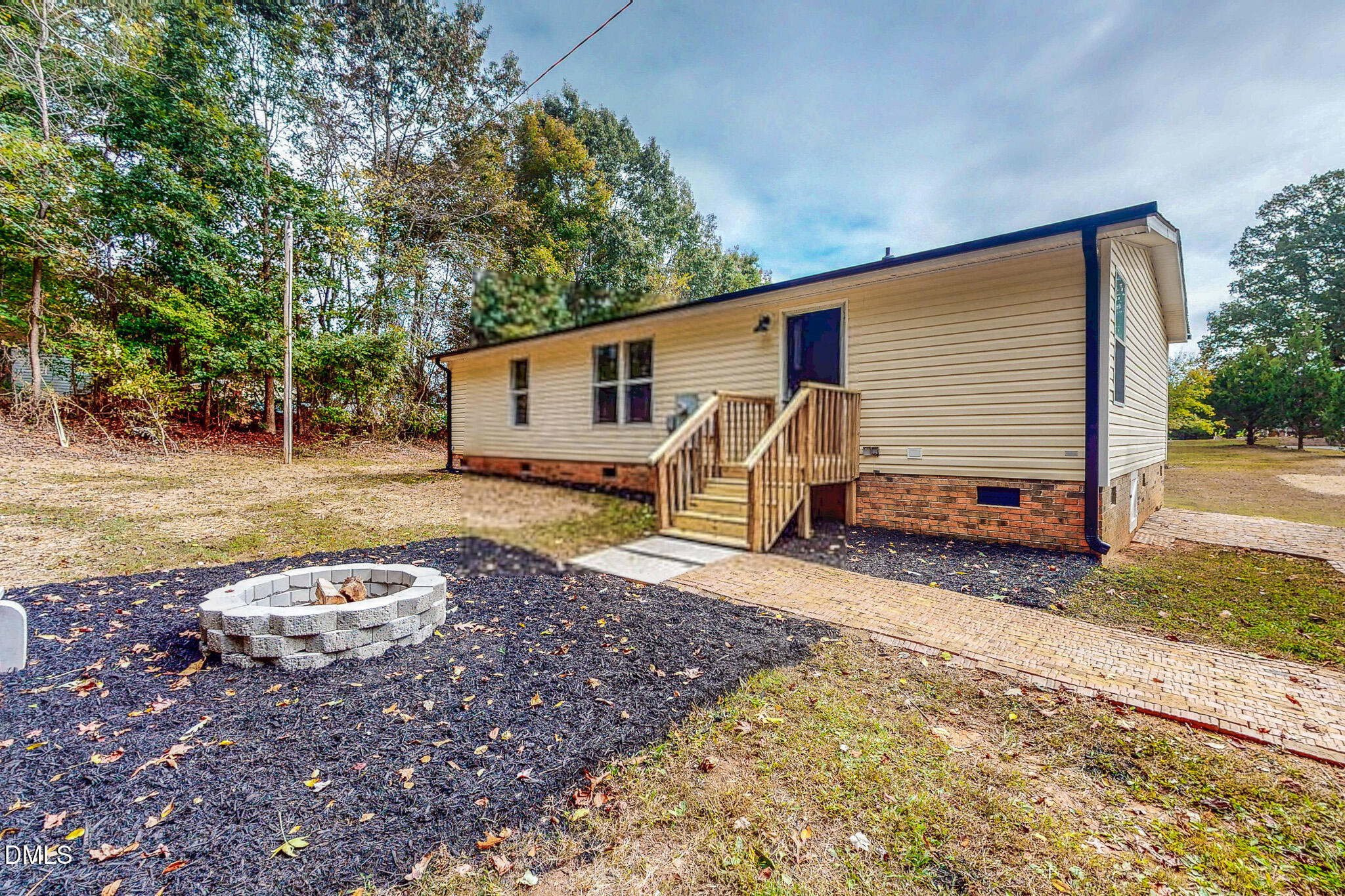 1469 Mollie Mooney Road Roxboro, NC 27574 - Photo 23 of 52 a view of a back yard of the house
