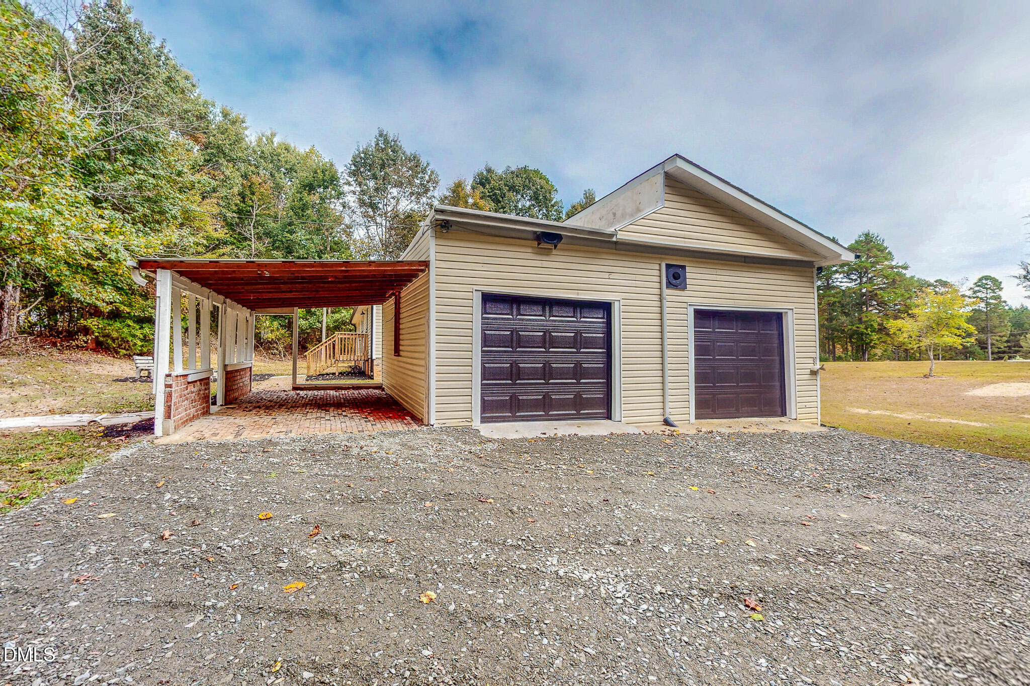 1469 Mollie Mooney Road Roxboro, NC 27574 - Photo 24 of 52 a view of a house with a porch and garage