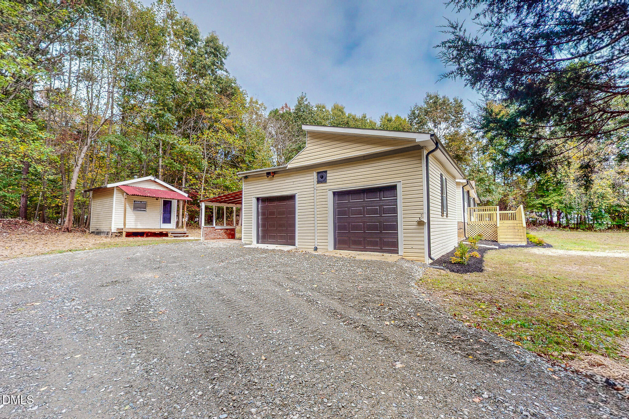 1469 Mollie Mooney Road Roxboro, NC 27574 - Photo 26 of 52 a view of a house with a yard and garage
