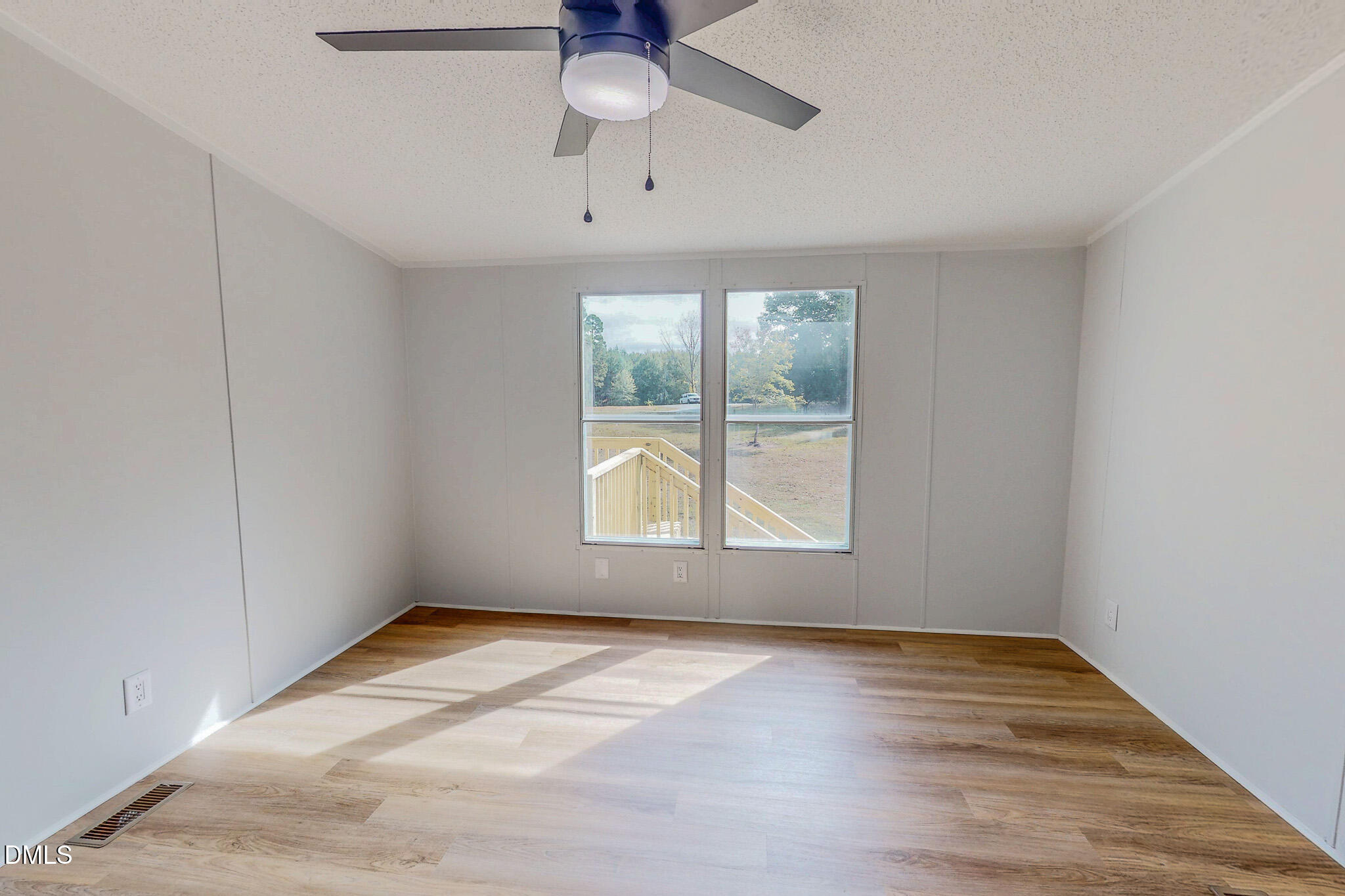 1469 Mollie Mooney Road Roxboro, NC 27574 - Photo 29 of 52 wooden floor in an empty room with a window