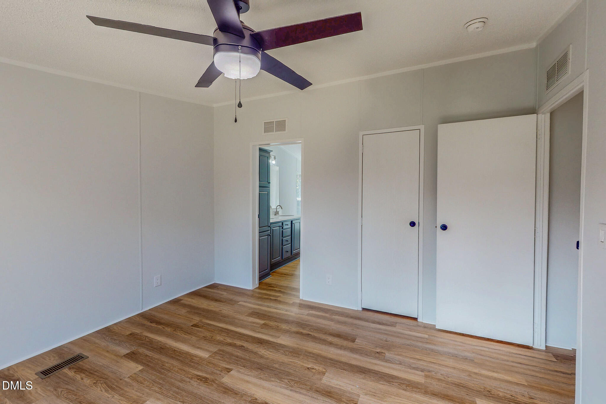 1469 Mollie Mooney Road Roxboro, NC 27574 - Photo 30 of 52 a view of empty room with wooden floor