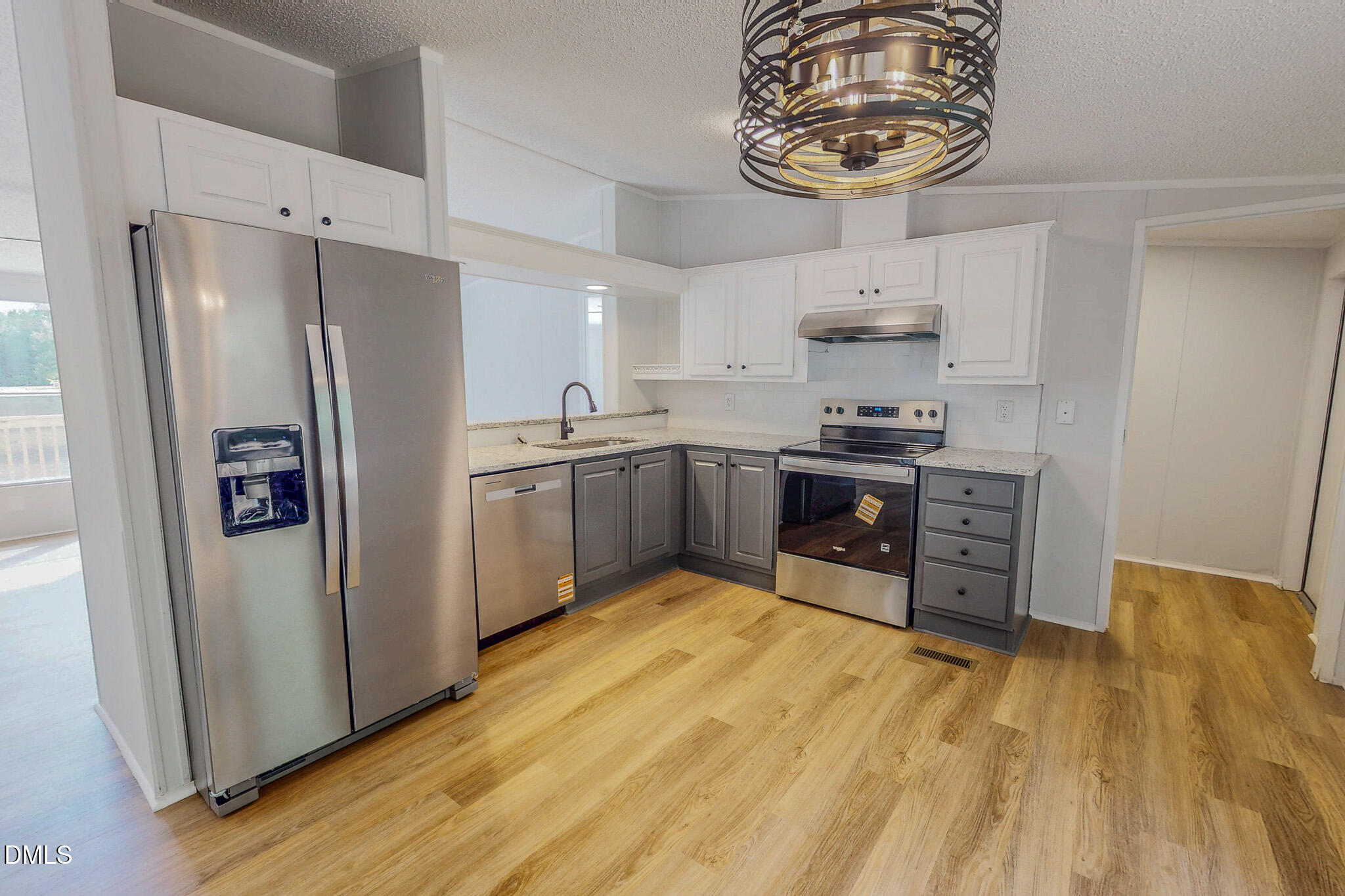 1469 Mollie Mooney Road Roxboro, NC 27574 - Photo 3 of 52 a kitchen with stainless steel appliances granite countertop a refrigerator and a stove top oven