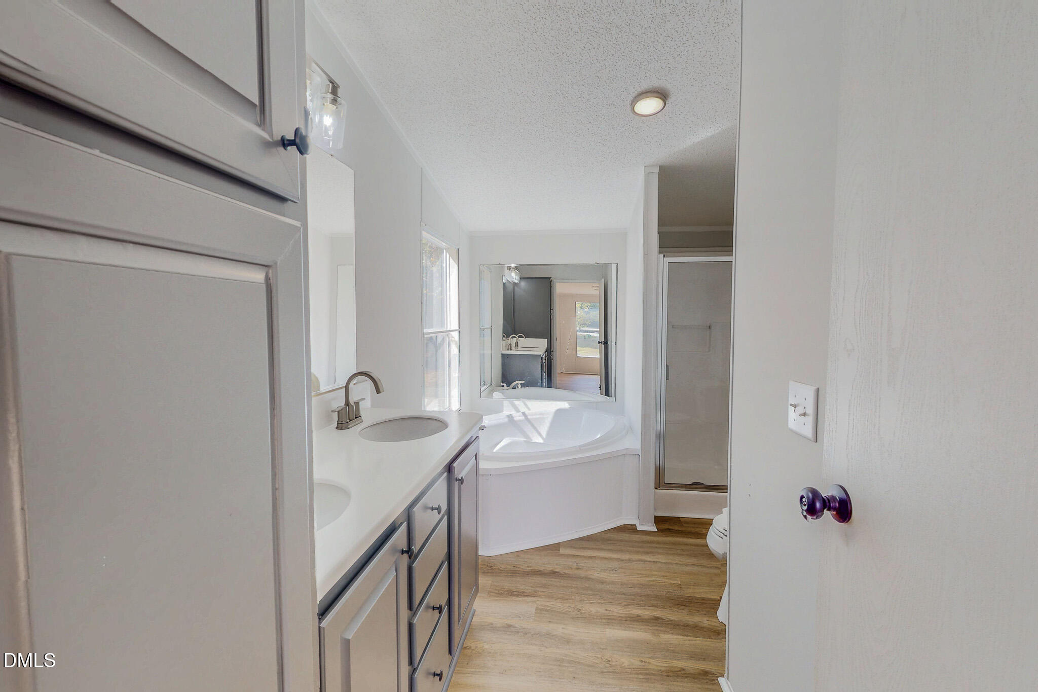 1469 Mollie Mooney Road Roxboro, NC 27574 - Photo 34 of 52 a bathroom with a sink and a mirror