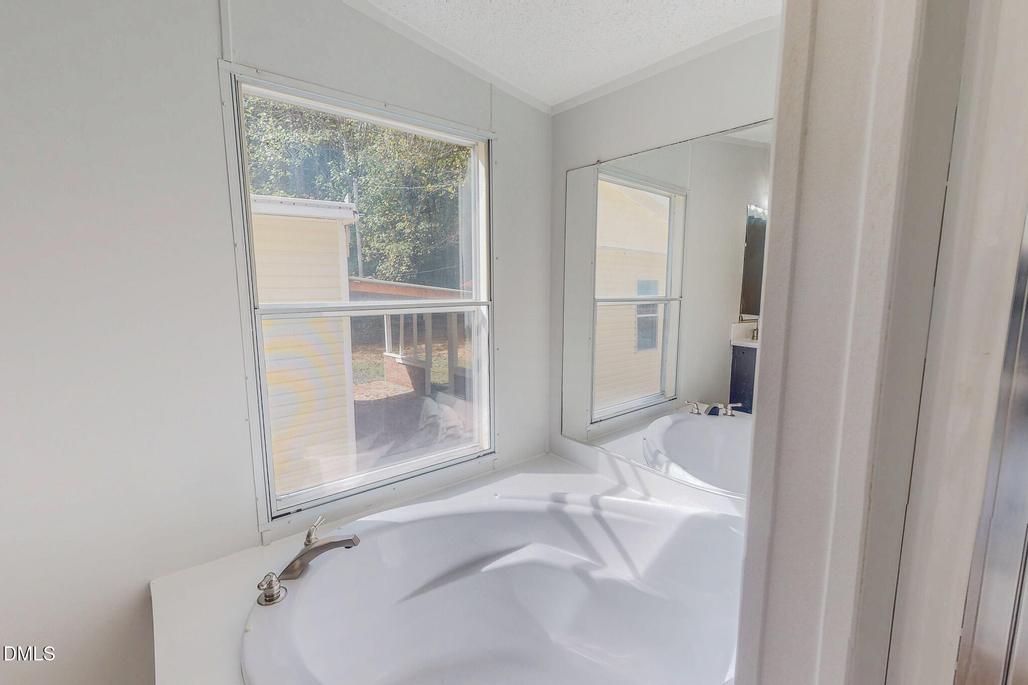 1469 Mollie Mooney Road Roxboro, NC 27574 - Photo 36 of 52 a bathroom with a sink and a bathtub