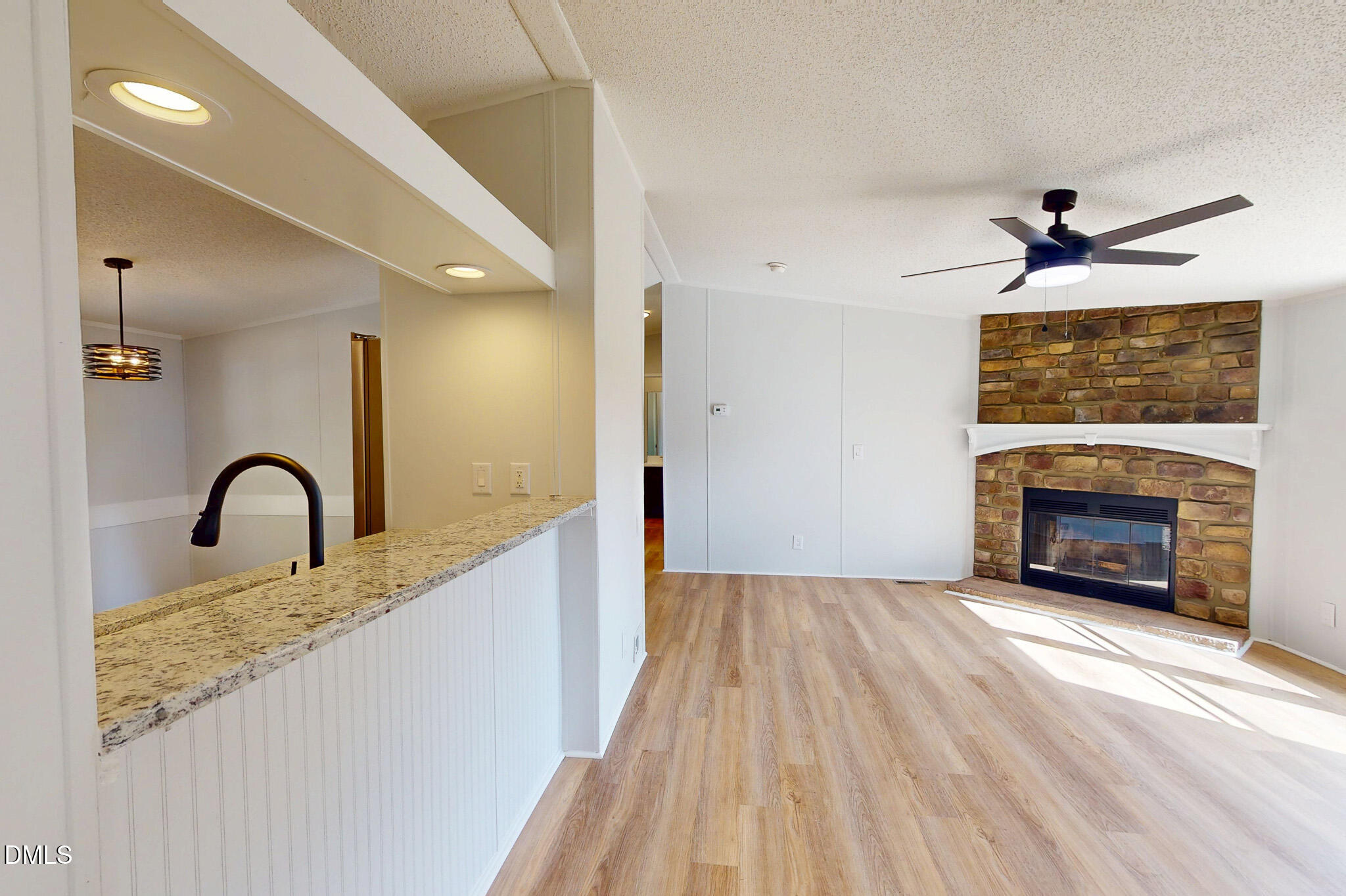 1469 Mollie Mooney Road Roxboro, NC 27574 - Photo 37 of 52 a view of a hallway with a fireplace
