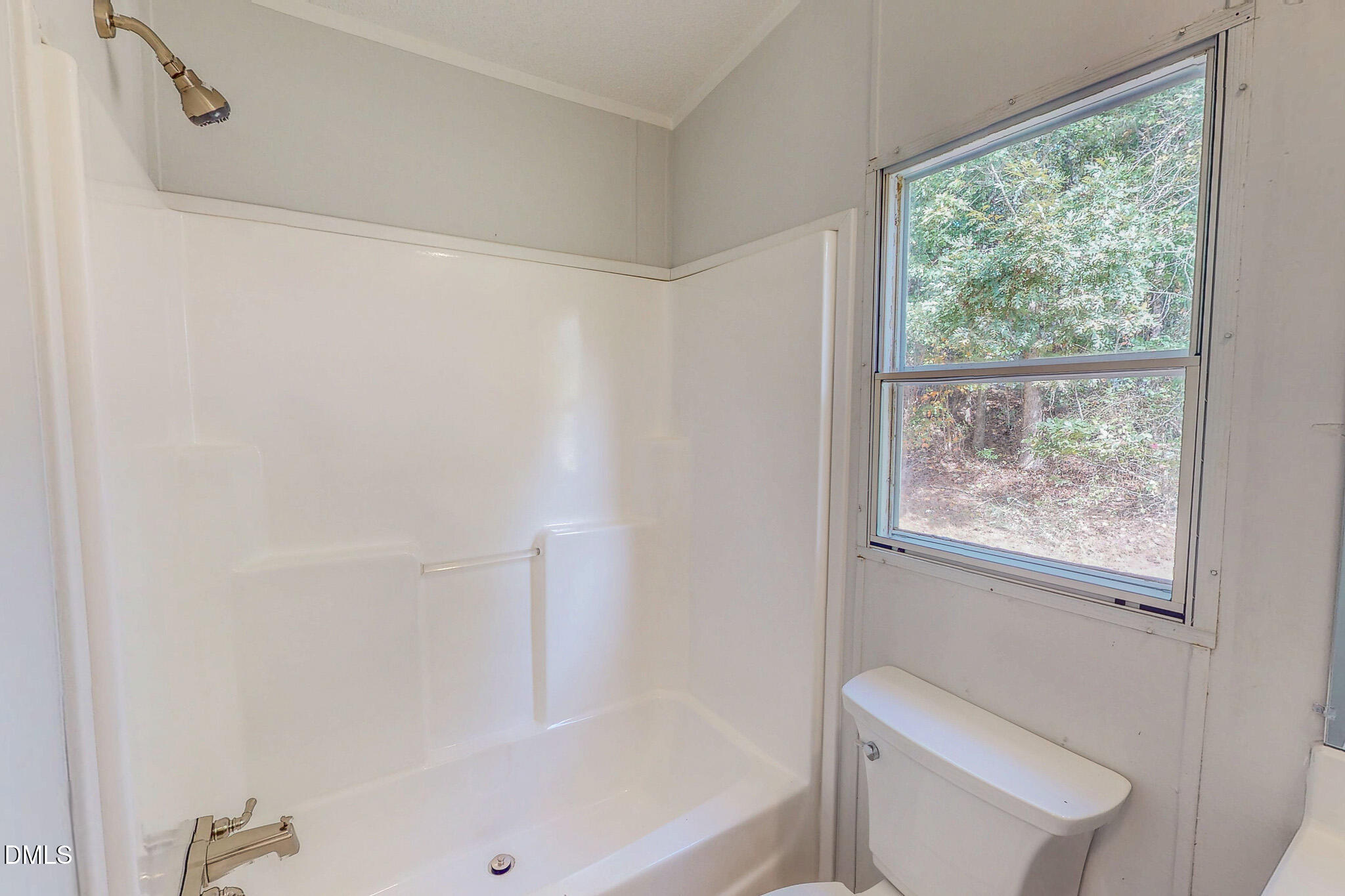 1469 Mollie Mooney Road Roxboro, NC 27574 - Photo 43 of 52 a bath room with a toilet a bath tub and a shower