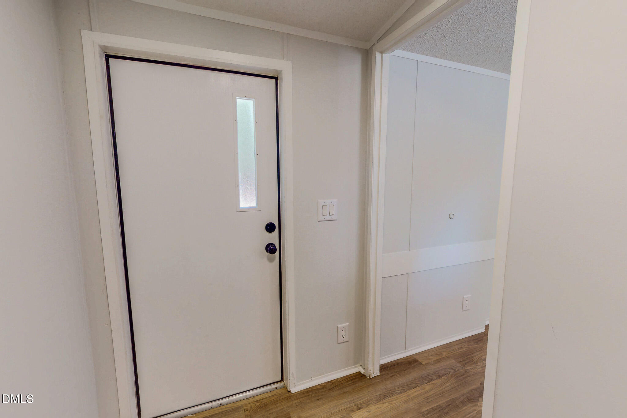 1469 Mollie Mooney Road Roxboro, NC 27574 - Photo 46 of 52 a view of a hallway with wooden floor