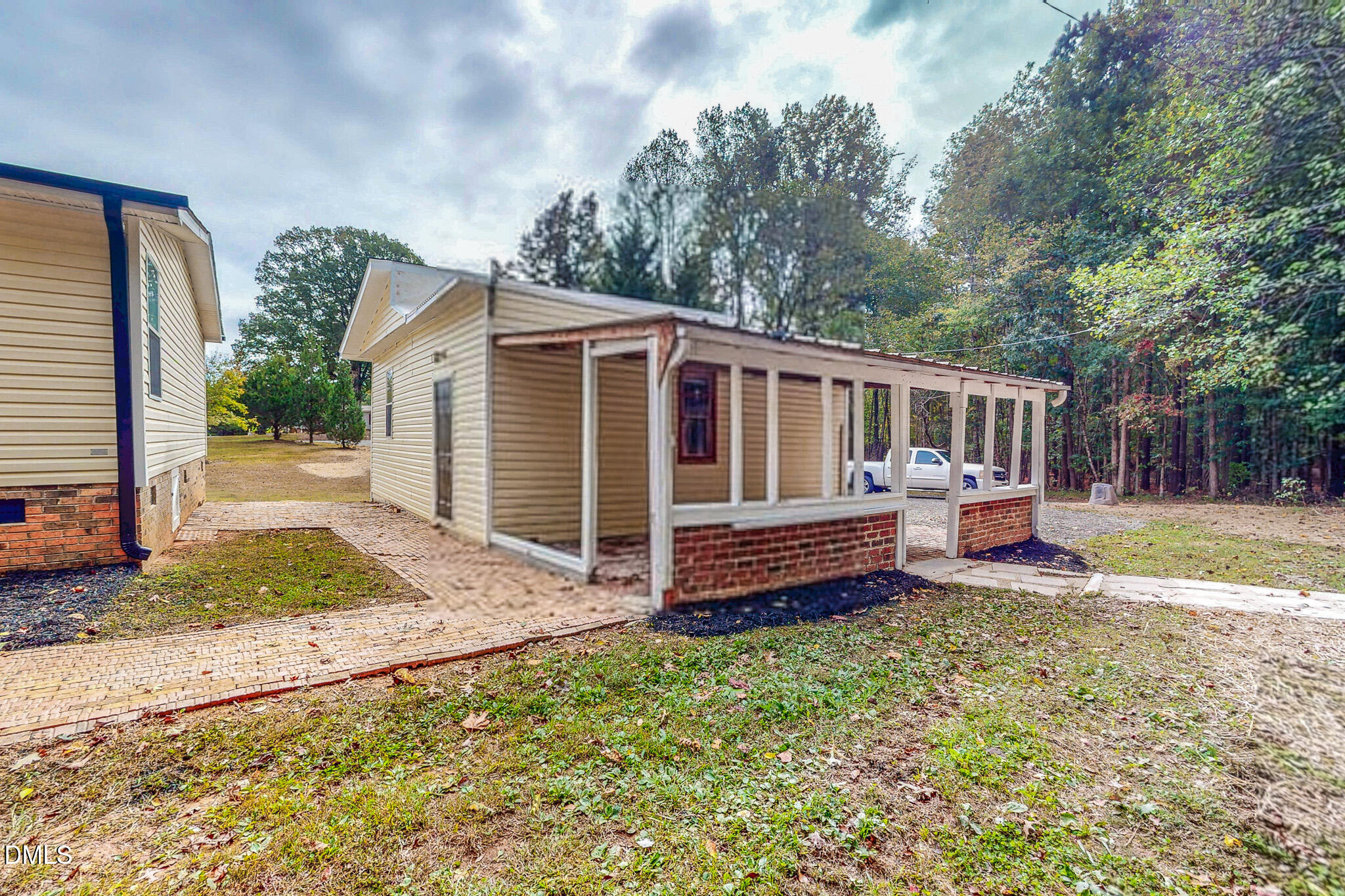 1469 Mollie Mooney Road Roxboro, NC 27574 - Photo 49 of 52 a view of a house with wooden deck and furniture