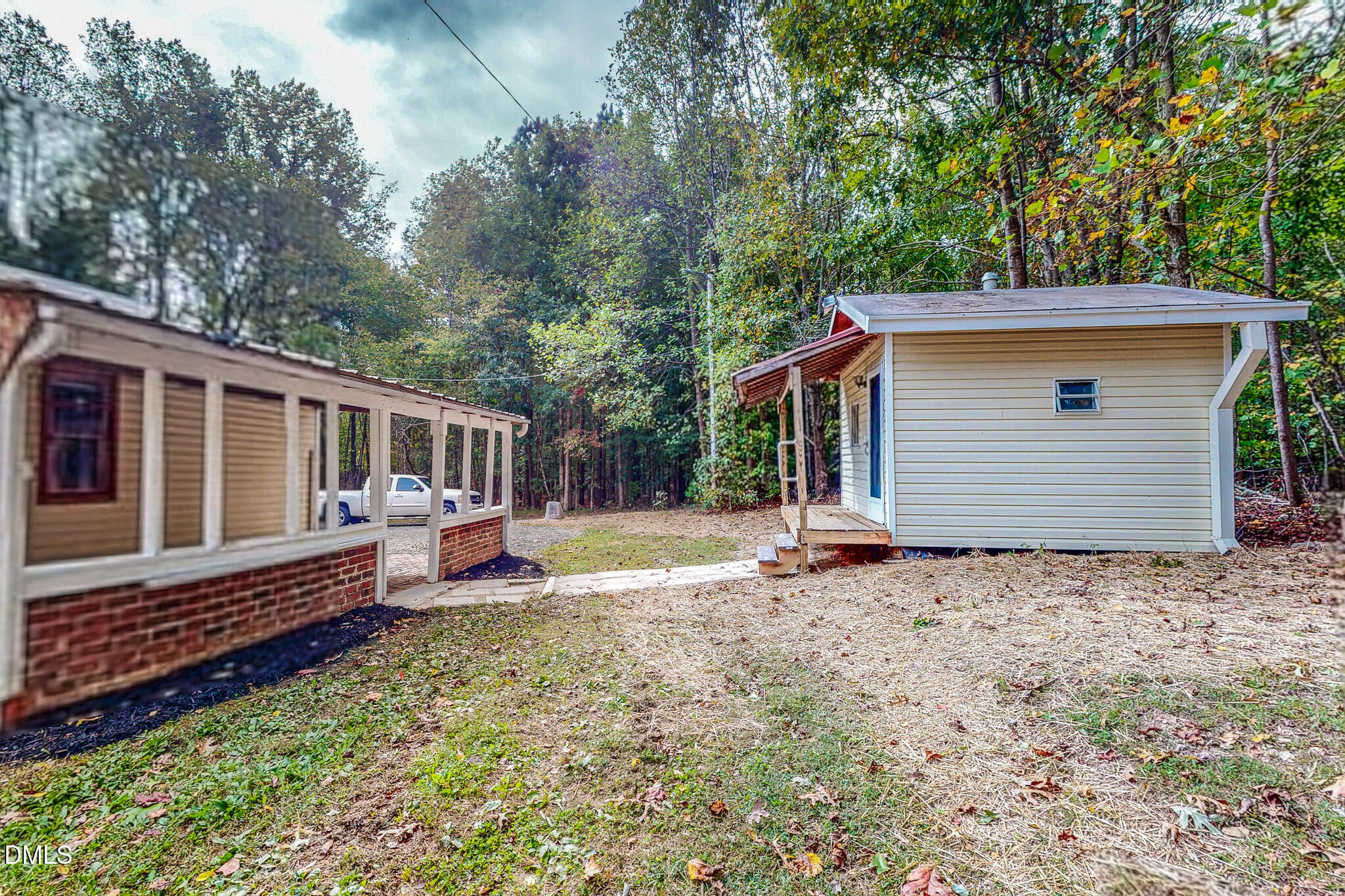 1469 Mollie Mooney Road Roxboro, NC 27574 - Photo 50 of 52 a view of a house with a yard and wooden fence