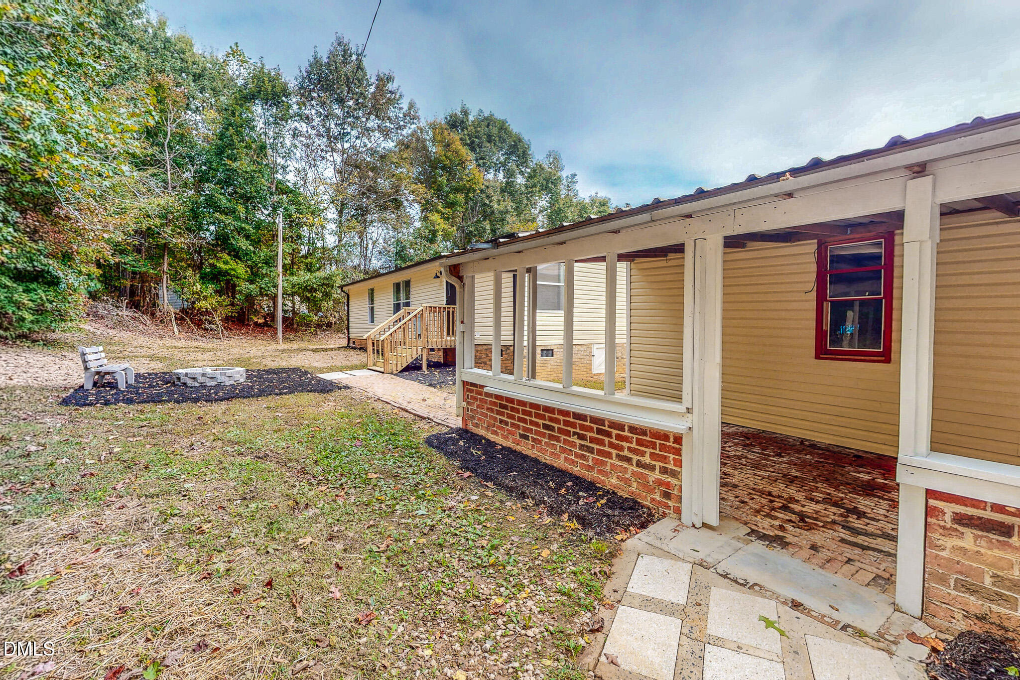 1469 Mollie Mooney Road Roxboro, NC 27574 - Photo 5 of 52 a front view of a house with garden