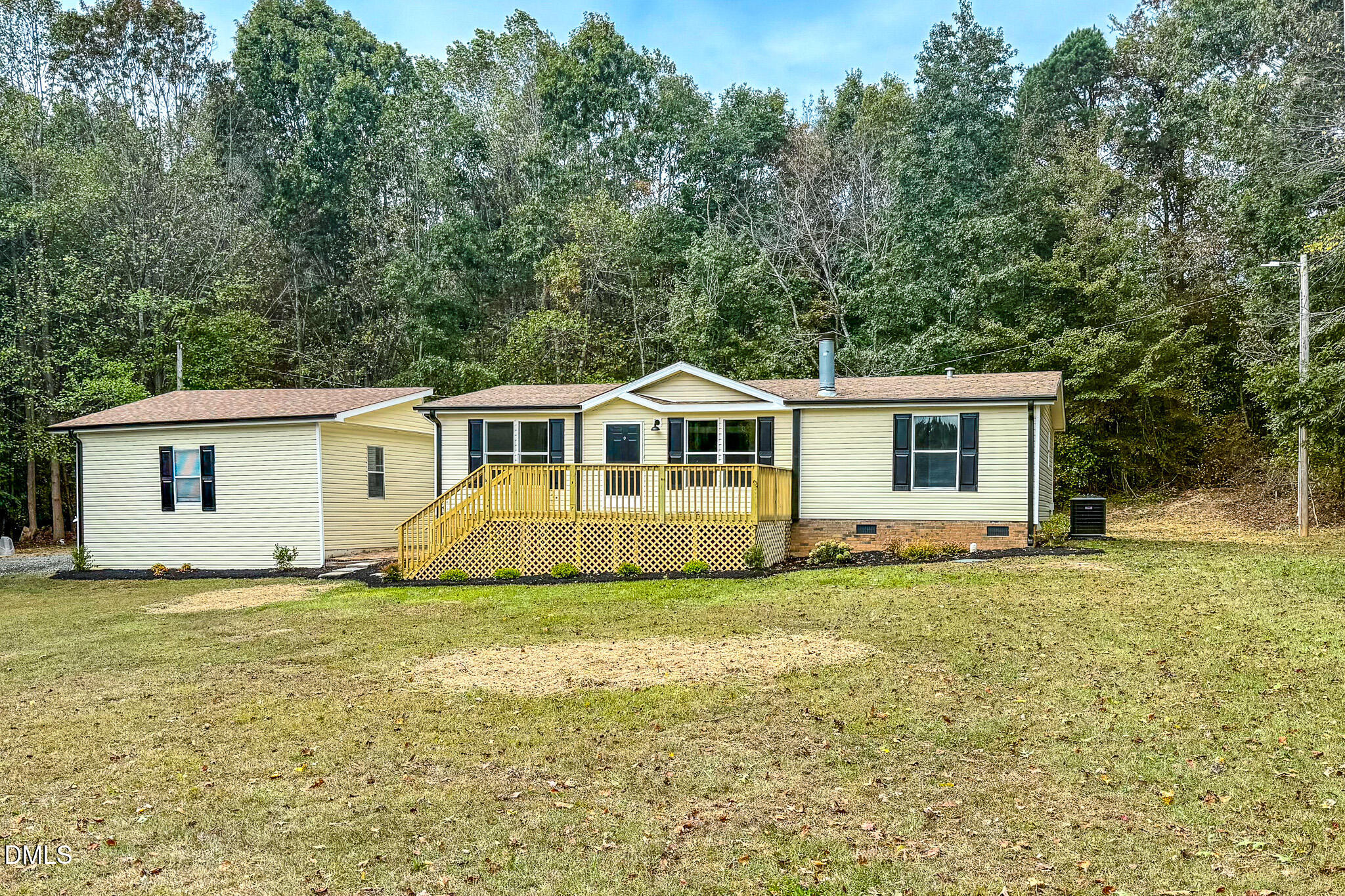 1469 Mollie Mooney Road Roxboro, NC 27574 - Photo 52 of 52 a view of a house with a yard