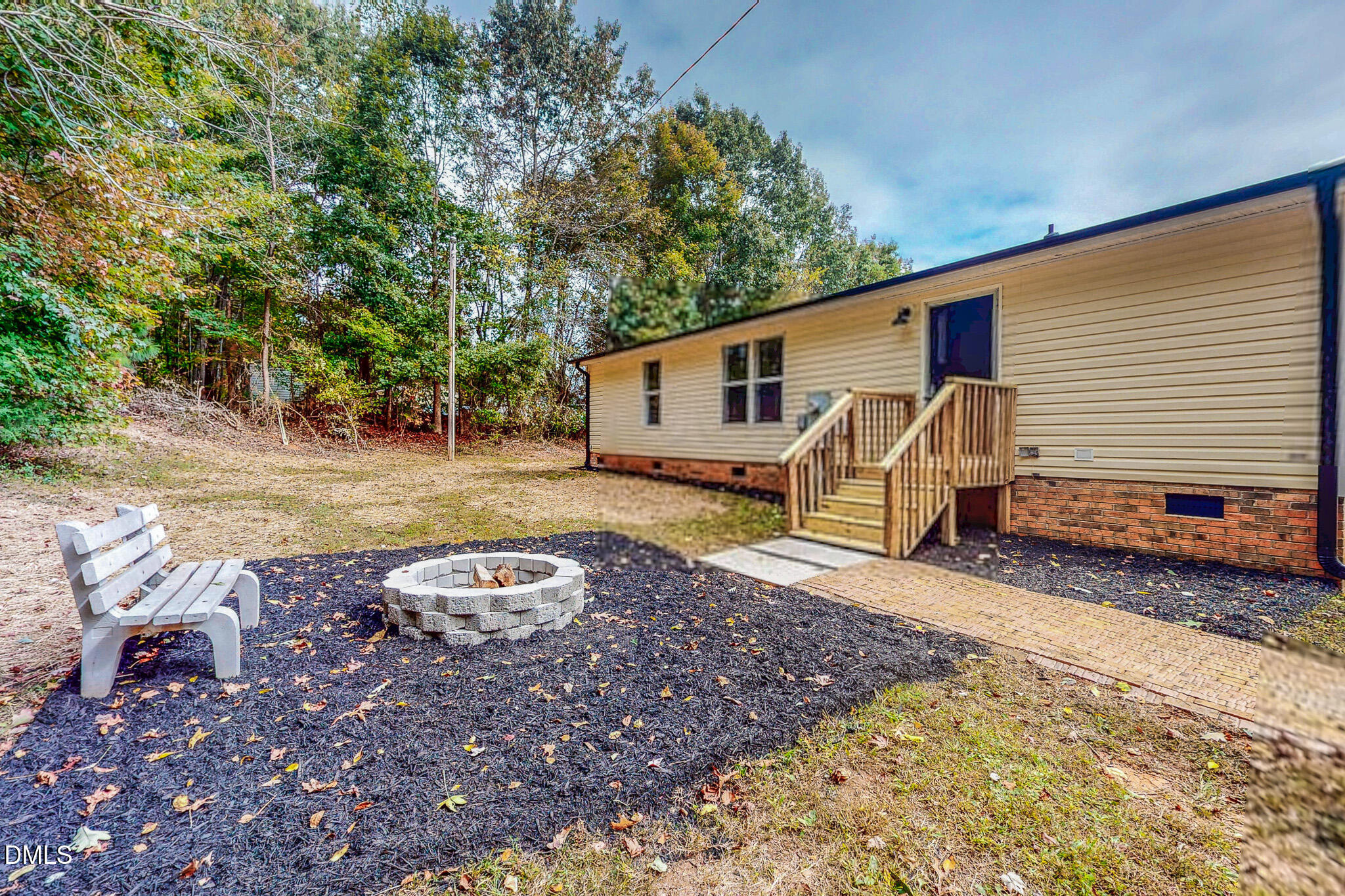 1469 Mollie Mooney Road Roxboro, NC 27574 - Photo 6 of 52 a backyard of a house with barbeque oven