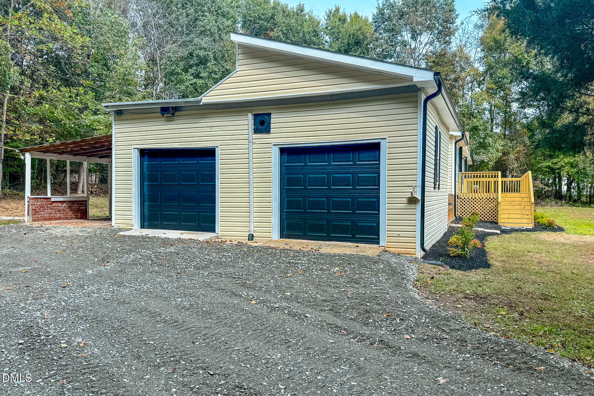 1469 Mollie Mooney Road Roxboro, NC 27574 - Photo 7 of 52 a front view of a house with a yard and garage
