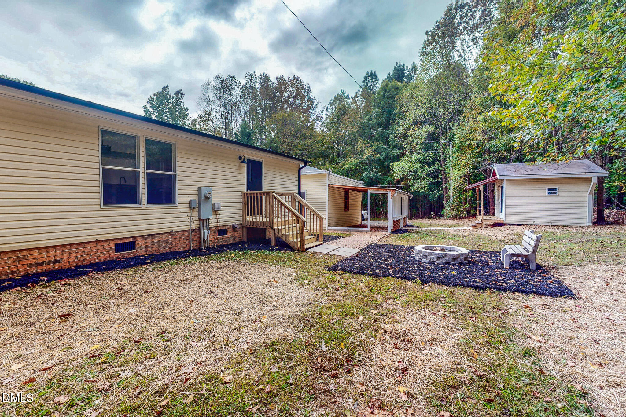 1469 Mollie Mooney Road Roxboro, NC 27574 - Photo 8 of 52 a house view with a backyard space