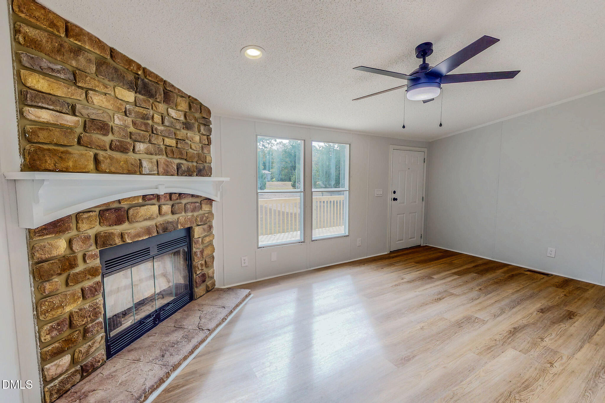 1469 Mollie Mooney Road Roxboro, NC 27574 - Photo 10 of 52 a view of an empty room with a fireplace and a window
