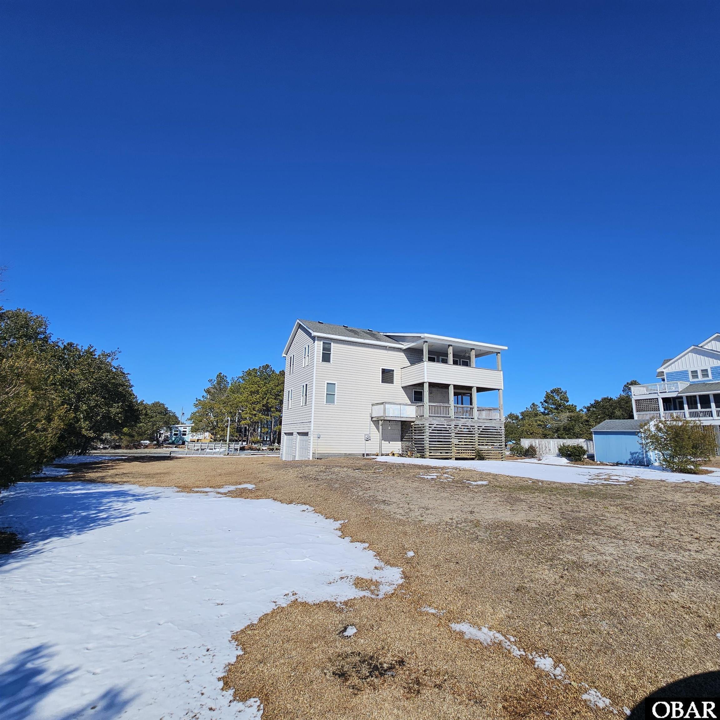 527 Swan Road Corolla, NC 27927 - Photo 3 of 50 South side
