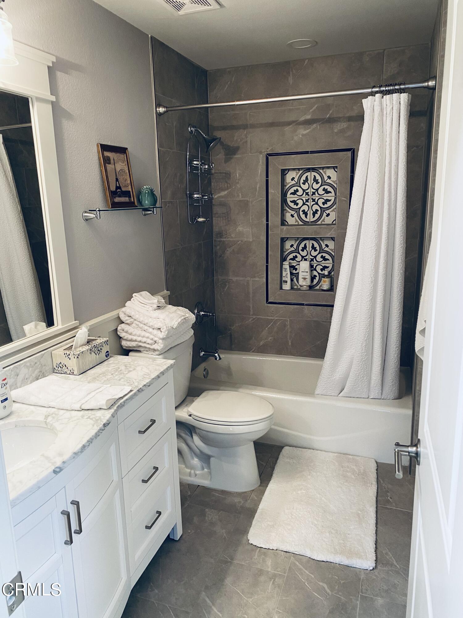 9908 Cheyenne Circle Ventura, CA 93004 - Photo 11 of 19 a bathroom with a toilet a sink and shower