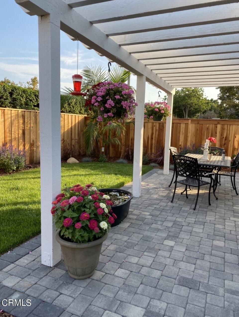 9908 Cheyenne Circle Ventura, CA 93004 - Photo 16 of 19 a view of a dining room with furniture and a garden