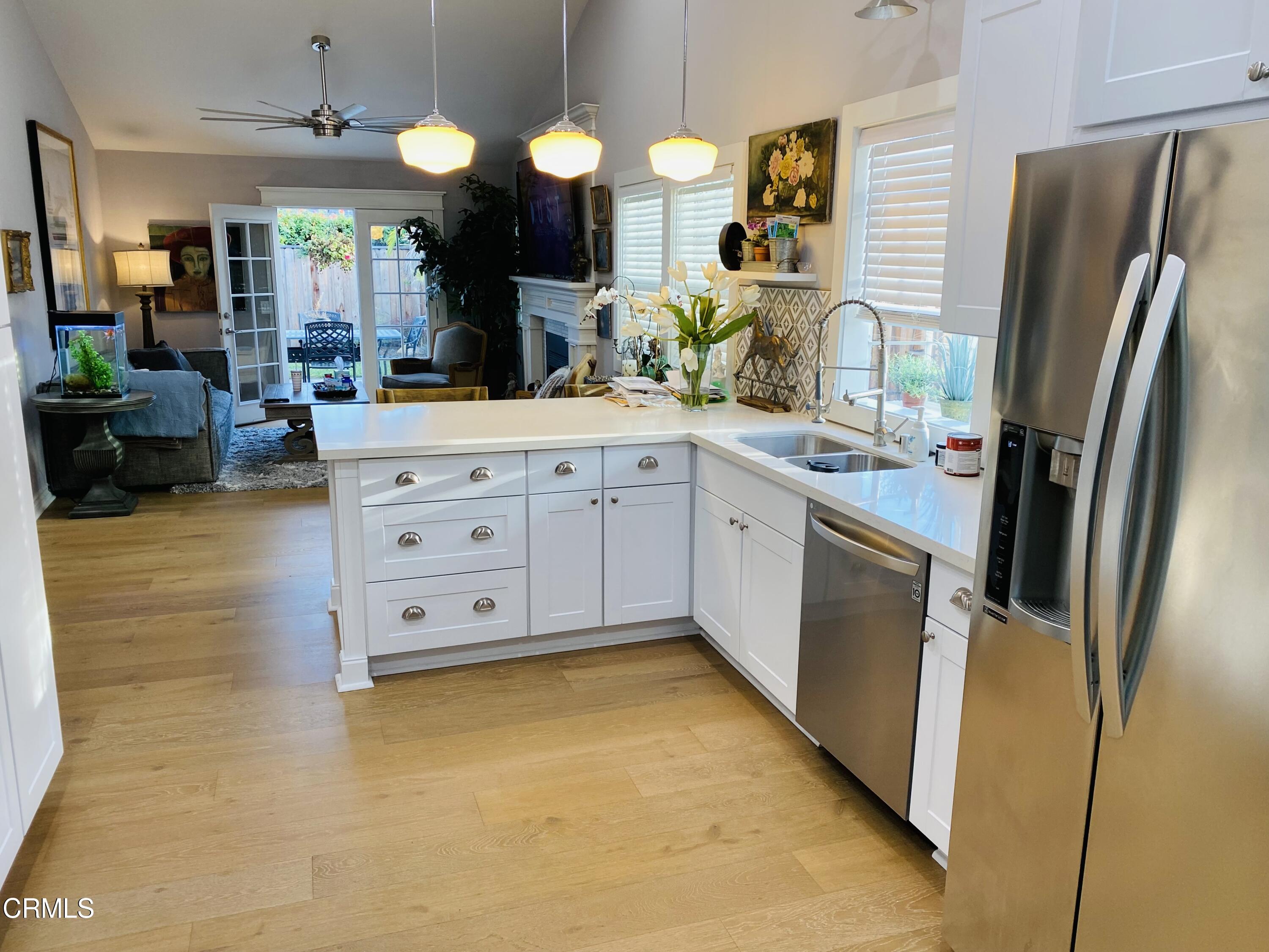 9908 Cheyenne Circle Ventura, CA 93004 - Photo 7 of 19 a kitchen with stainless steel appliances granite countertop a sink a stove top oven a refrigerator and dishwasher