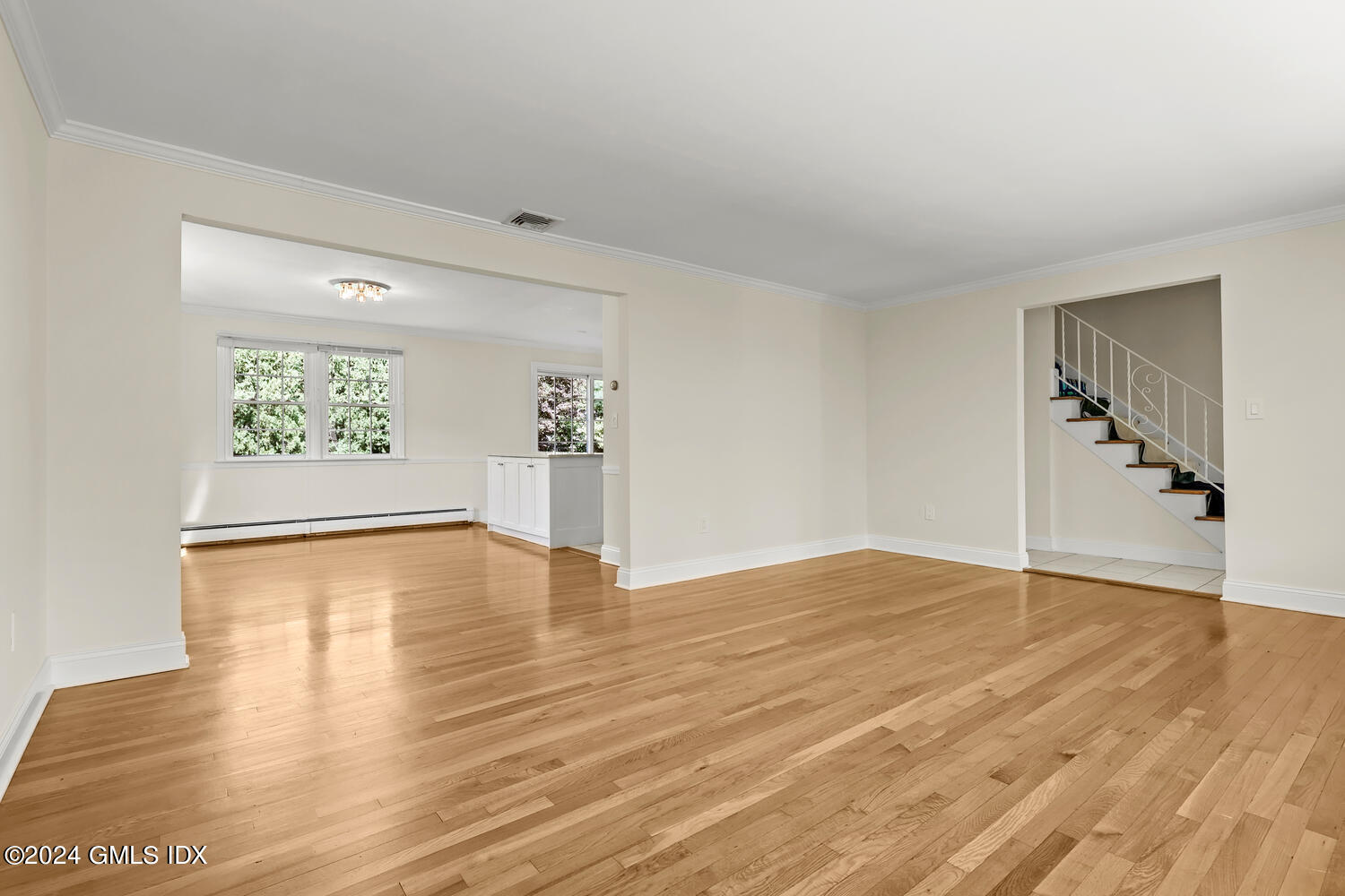 32 Rainbow Drive Riverside, CT 06878 - Photo 2 of 19 a view of an empty room with window and wooden floor