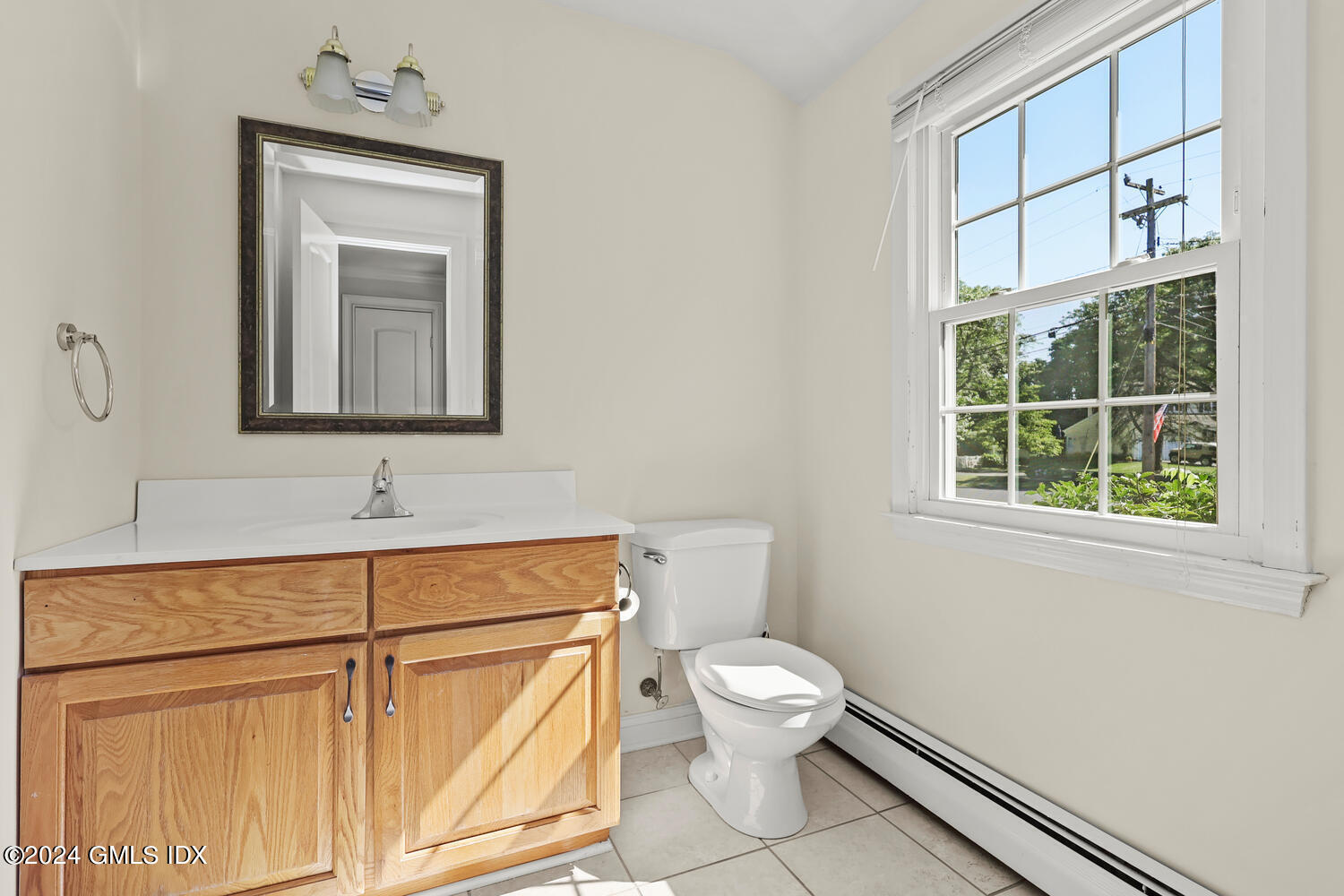 32 Rainbow Drive Riverside, CT 06878 - Photo 7 of 19 a bathroom with a toilet sink and mirror