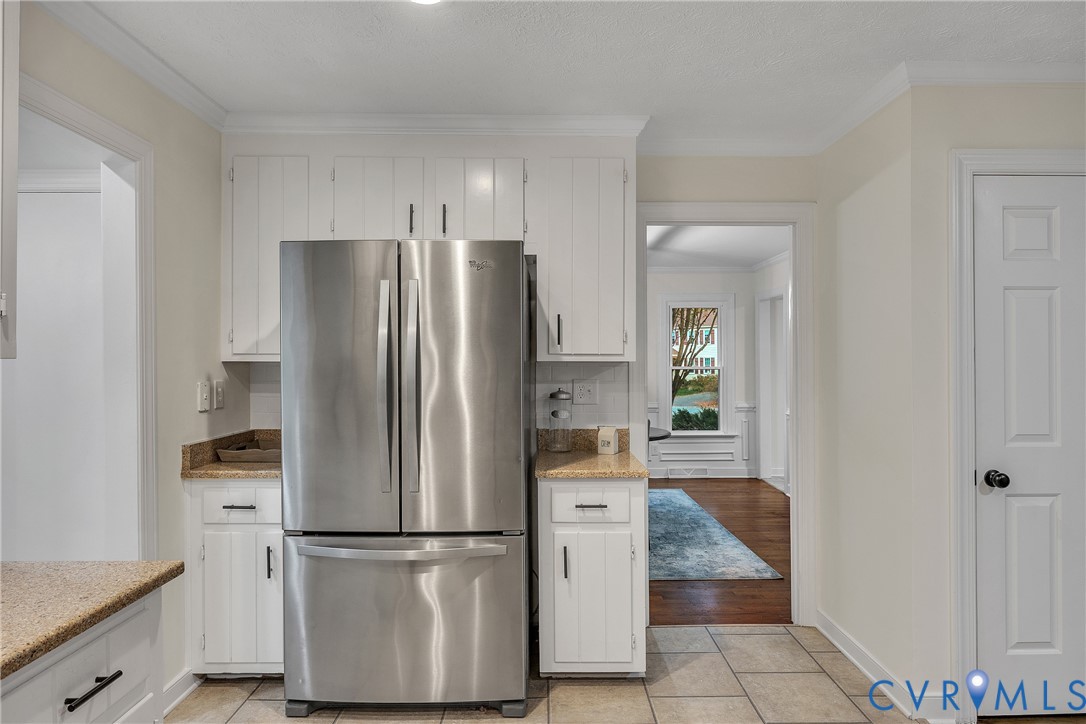 2604 Whispering Oaks Terrace Midlothian, VA 23112 - Photo 13 of 35 Kitchen with freestanding refrigerator, white cabi