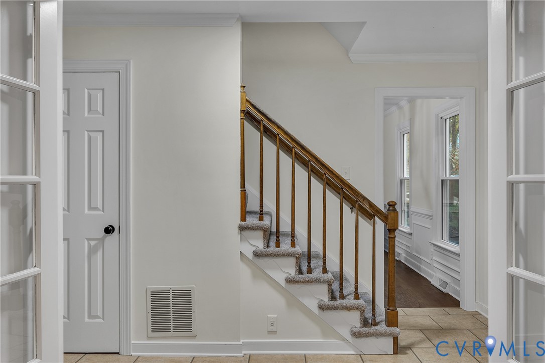 2604 Whispering Oaks Terrace Midlothian, VA 23112 - Photo 17 of 35 Stairway with ornamental molding, tile patterned f
