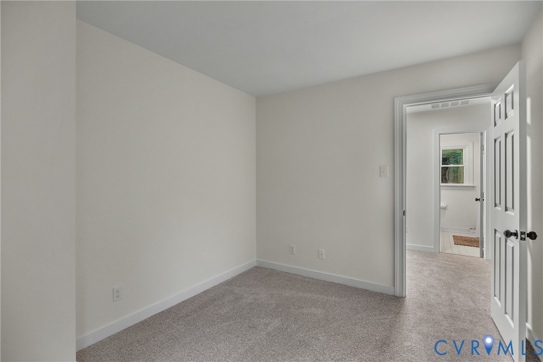 2604 Whispering Oaks Terrace Midlothian, VA 23112 - Photo 23 of 35 Empty room with baseboards and light carpet