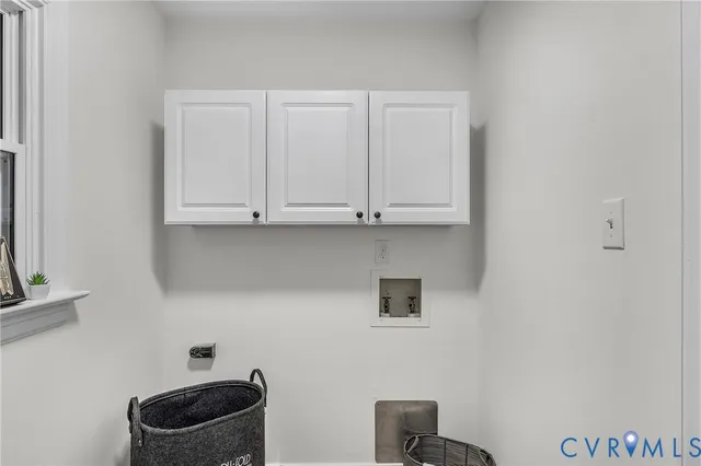 a room with cabinets and a wooden floor