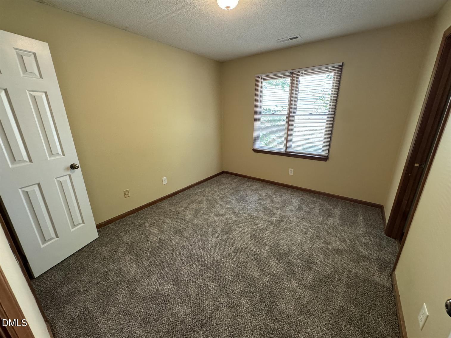 5534 Kaplan Drive Raleigh, NC 27606 - Photo 12 of 15 an empty room with windows