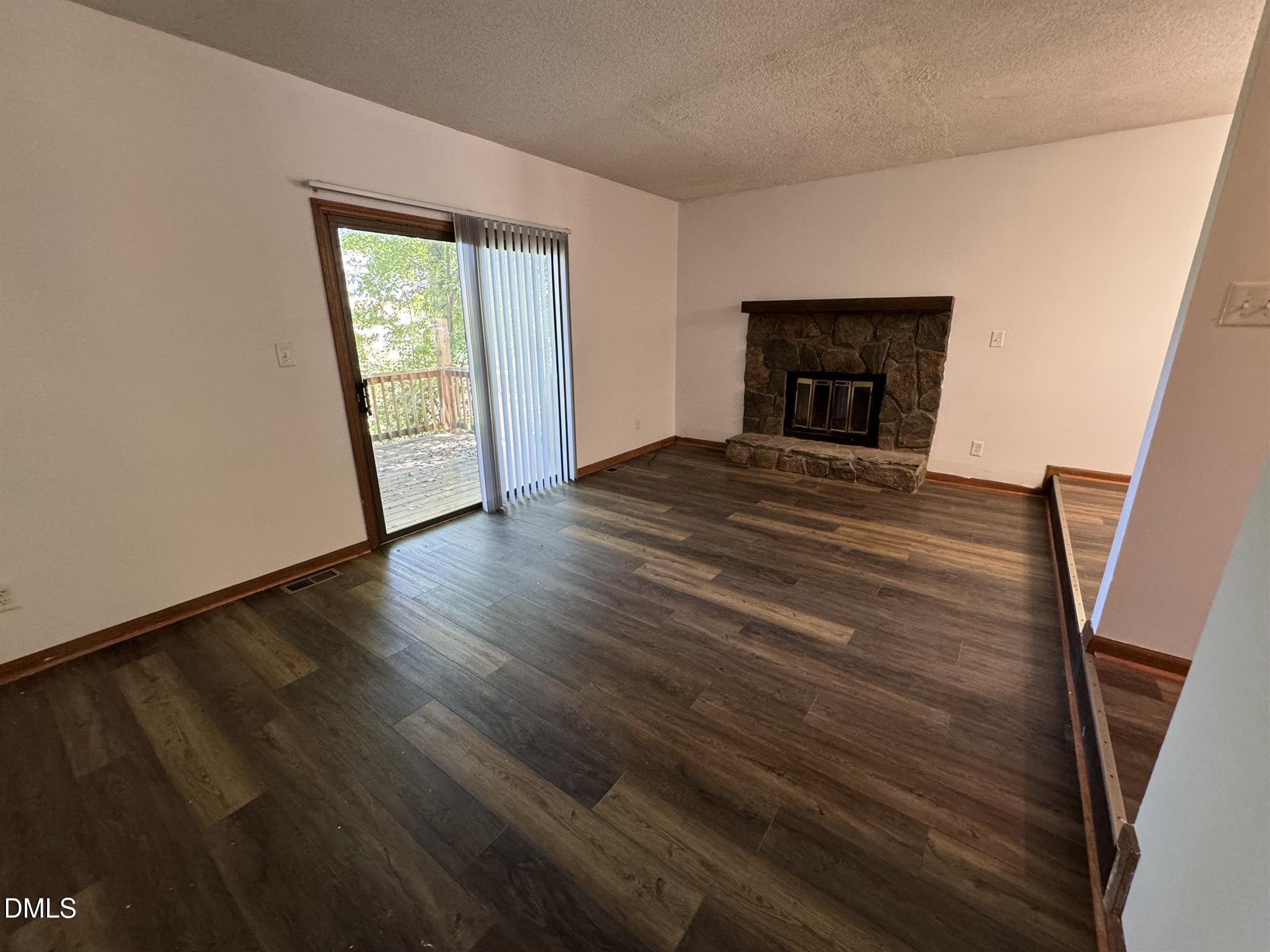 5534 Kaplan Drive Raleigh, NC 27606 - Photo 2 of 15 a room with wooden floor and a window