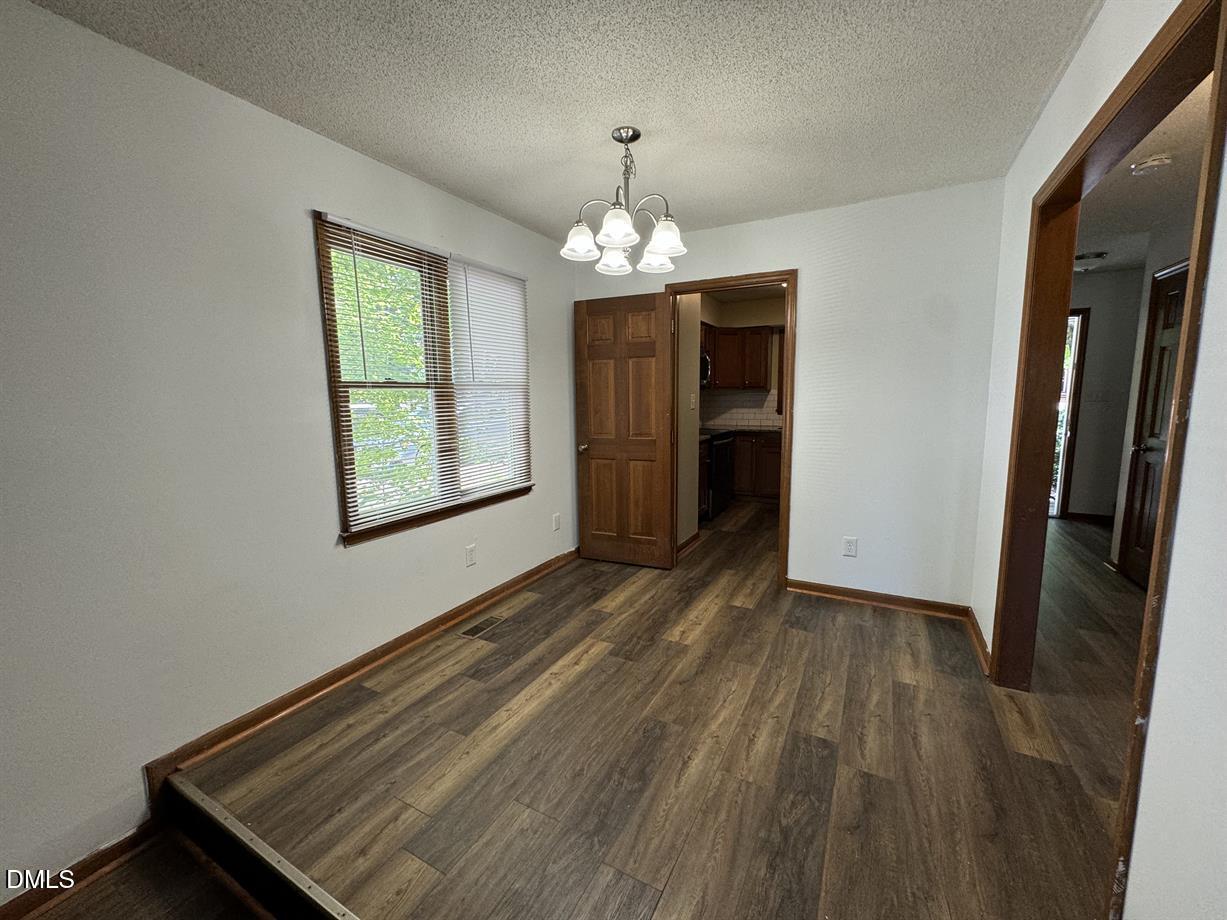5534 Kaplan Drive Raleigh, NC 27606 - Photo 6 of 15 a view of an empty room with a window