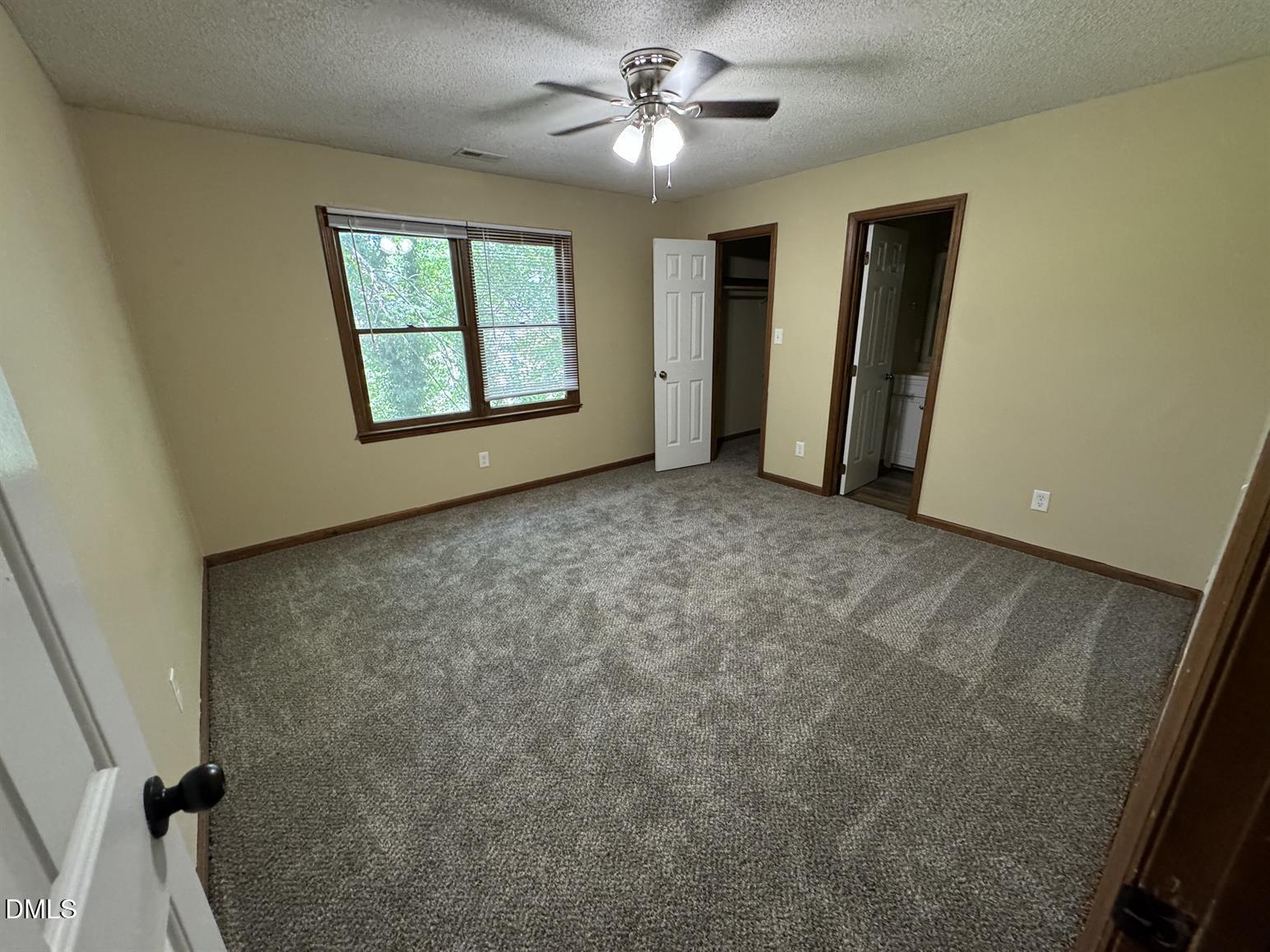 5534 Kaplan Drive Raleigh, NC 27606 - Photo 9 of 15 wooden floor in an empty room with a window
