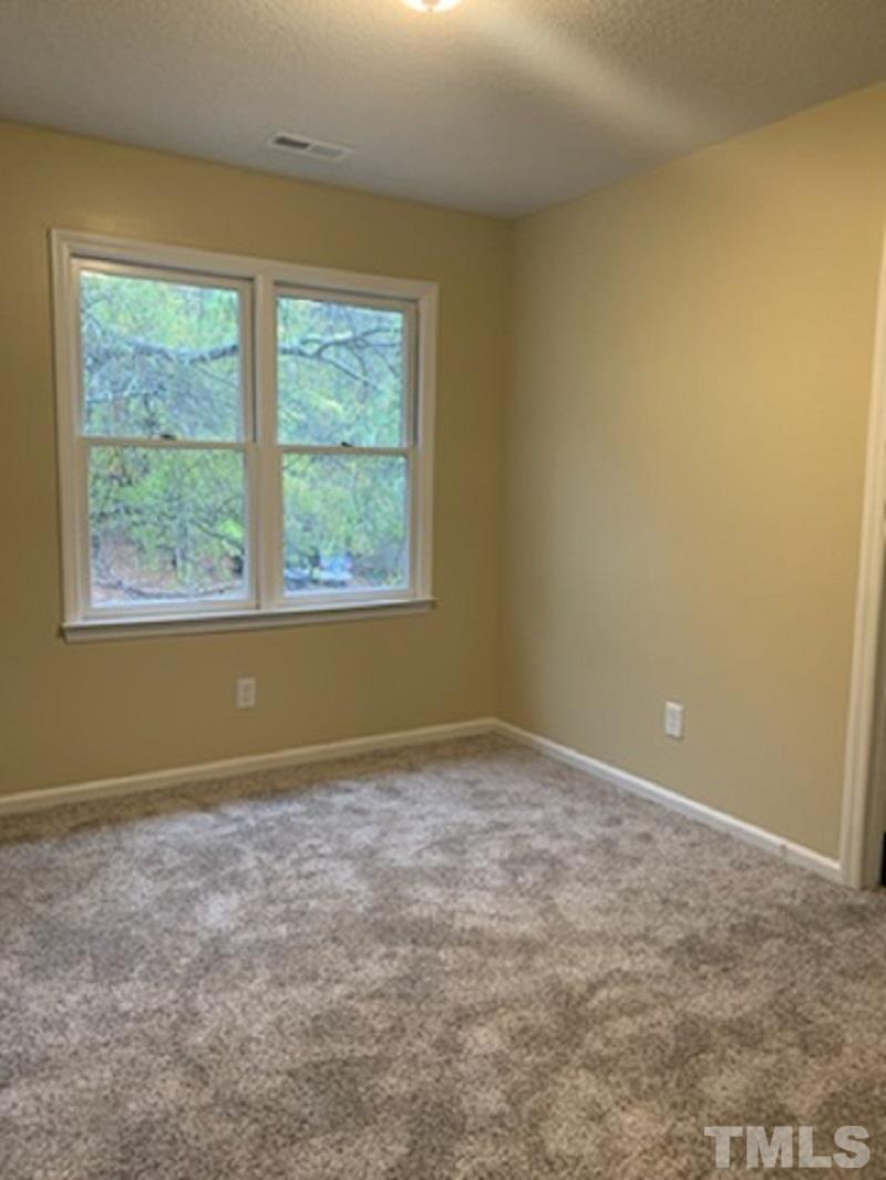 5534 Kaplan Drive Raleigh, NC 27606 - Photo 10 of 15 an empty room with a window