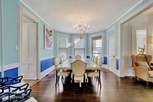 a kitchen with a sink a counter top space stainless steel appliances and cabinets