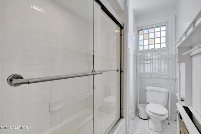 a bed room with two bed and a night stand