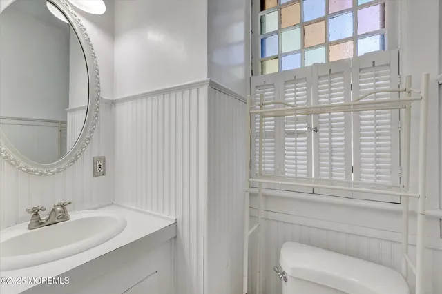 a bathroom with a sink a shower and a mirror