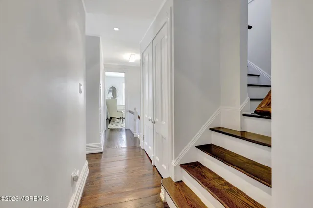 a view of a house with pool and chairs