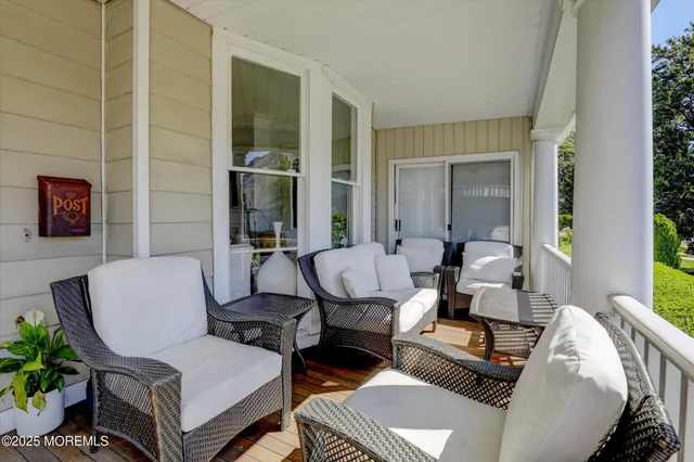 a view of entryway with livingroom and wooden floor