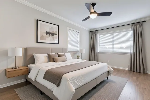 a bedroom with a large bed and a window