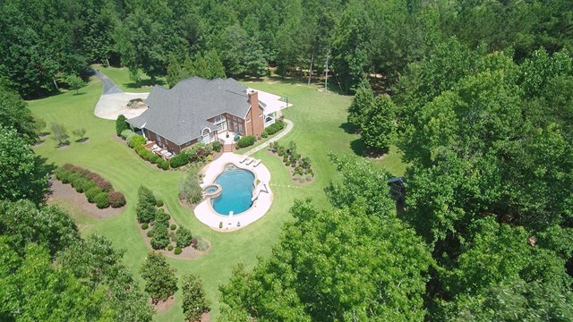 8630 East Hopewell Road Musella, GA 31066 - Photo 2 of 28 an aerial view of a house with yard swimming pool and outdoor seating