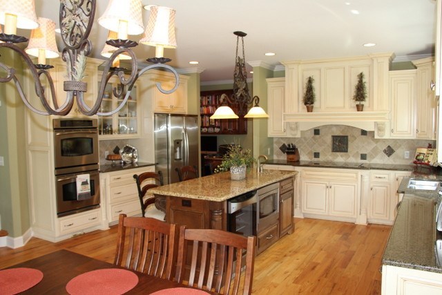 8630 East Hopewell Road Musella, GA 31066 - Photo 11 of 28 a kitchen with stainless steel appliances granite countertop a sink a stove and chairs