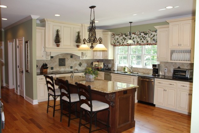 8630 East Hopewell Road Musella, GA 31066 - Photo 12 of 28 a kitchen with stainless steel appliances granite countertop a stove a sink a microwave a dining table and chairs
