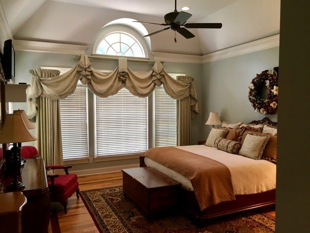 8630 East Hopewell Road Musella, GA 31066 - Photo 16 of 28 a bedroom with a bed dresser and a chandelier
